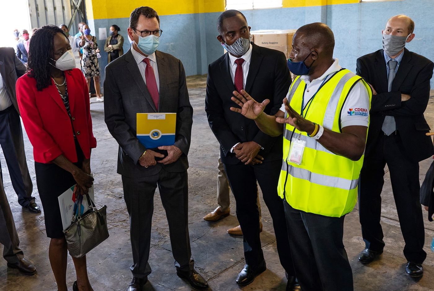 CDEMA Logistics Specialist, Major Curtis Dennie (r) with (from left) CDEMA Exec. Dir. (ag.) Elizabeth Riley, CDB President Dr. Warren Smith and Minister Kirk Humphrey. (CDB Photo)