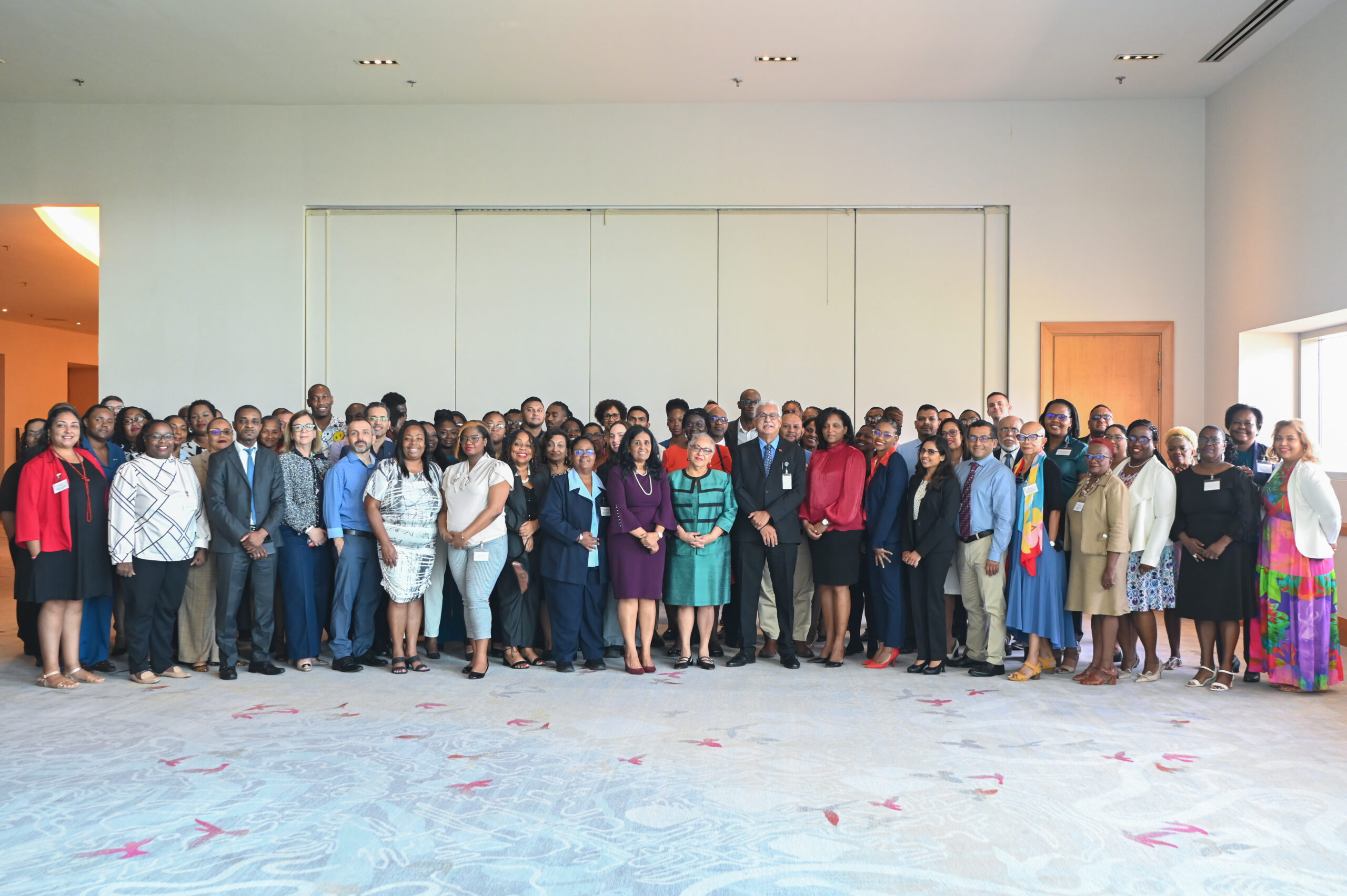 Participants at the Eight Meeting of National AIDS Programme Managers and Key Partners, pose with the Minister of Health of the Republic of Trinidad and Tobago, the Honourable Terrence Dyalsingh