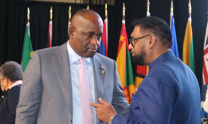 SUMMIT Talks: President of Guyana, His Excellency Mohamed Irfaan Ali (r) in conversation with CARICOM Chair, the Hon. Roosevelt Skerrit, Prime Minister of Dominica