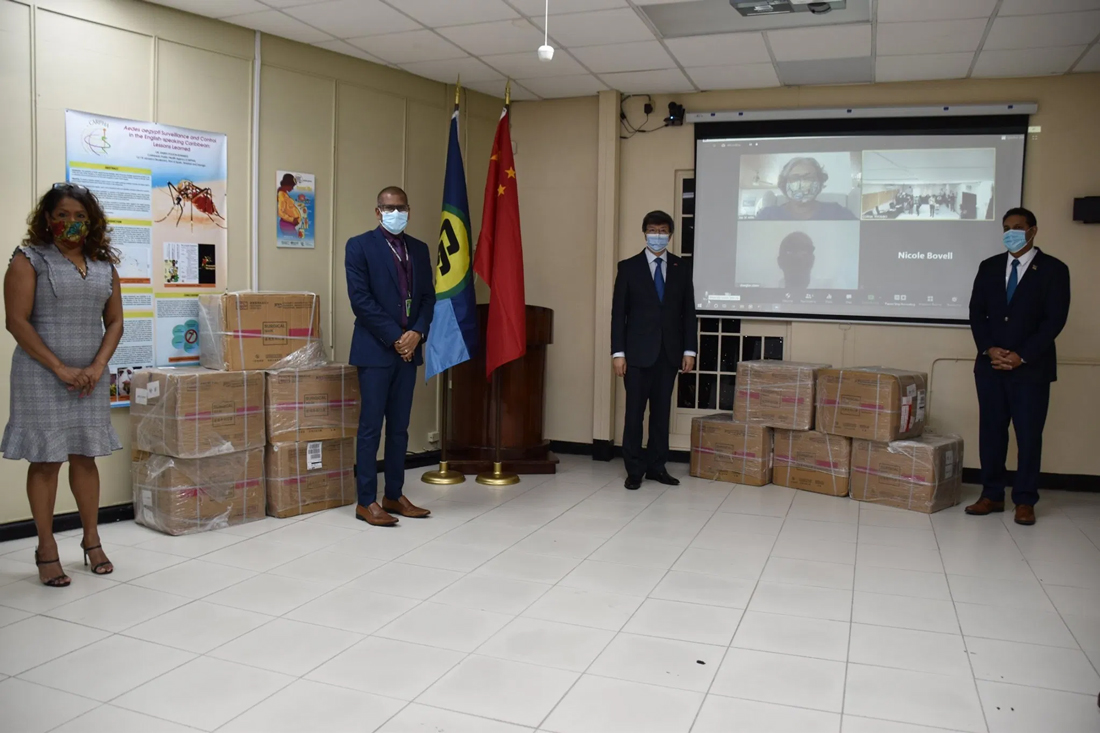 L-R): Dr. Lisa Indar and Dr. Mark Sami of CARPHA, H.E. Song Yumin and Dr. Roshan Parasram, CMO of Trinidad and Tobago at the ceremony. Dr. Joy St. John and Dr. Douglas Slater joined virtually