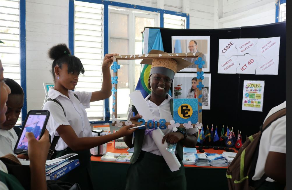 FLASHBACK: School girls at the CARICOM Booth at a 2018 career fair in Georgetown, Guyana