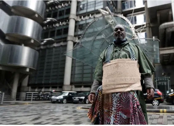 A demonstrator in front of Lloyds of London which recently apologised for its role in the Atlantic slave trade (Photo via Reuters)